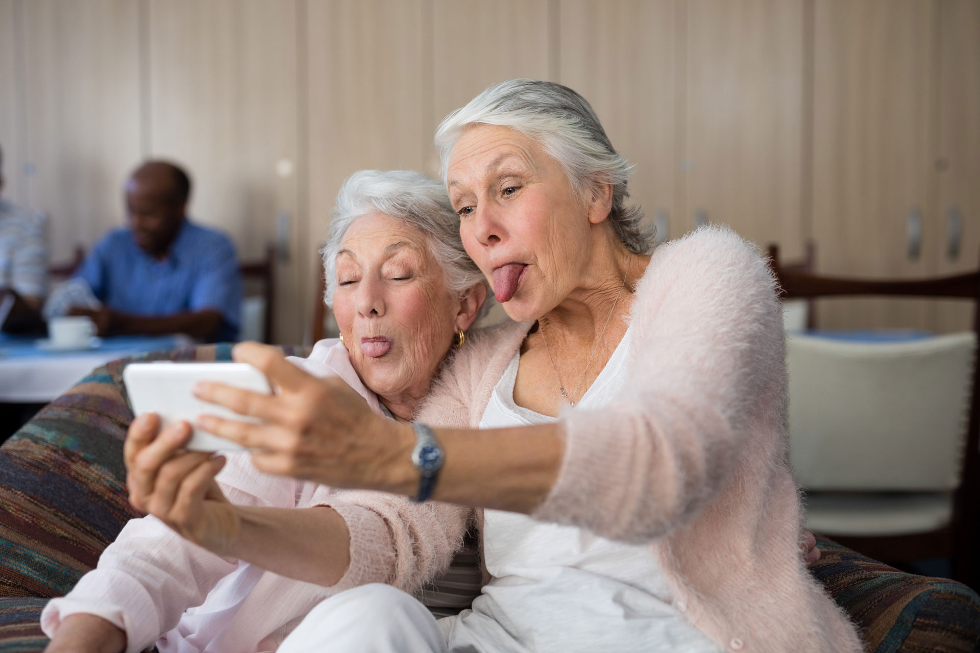 two residents taking a selfie with tongues out